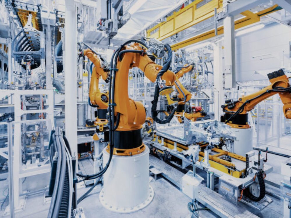 robotic arms in a car plant